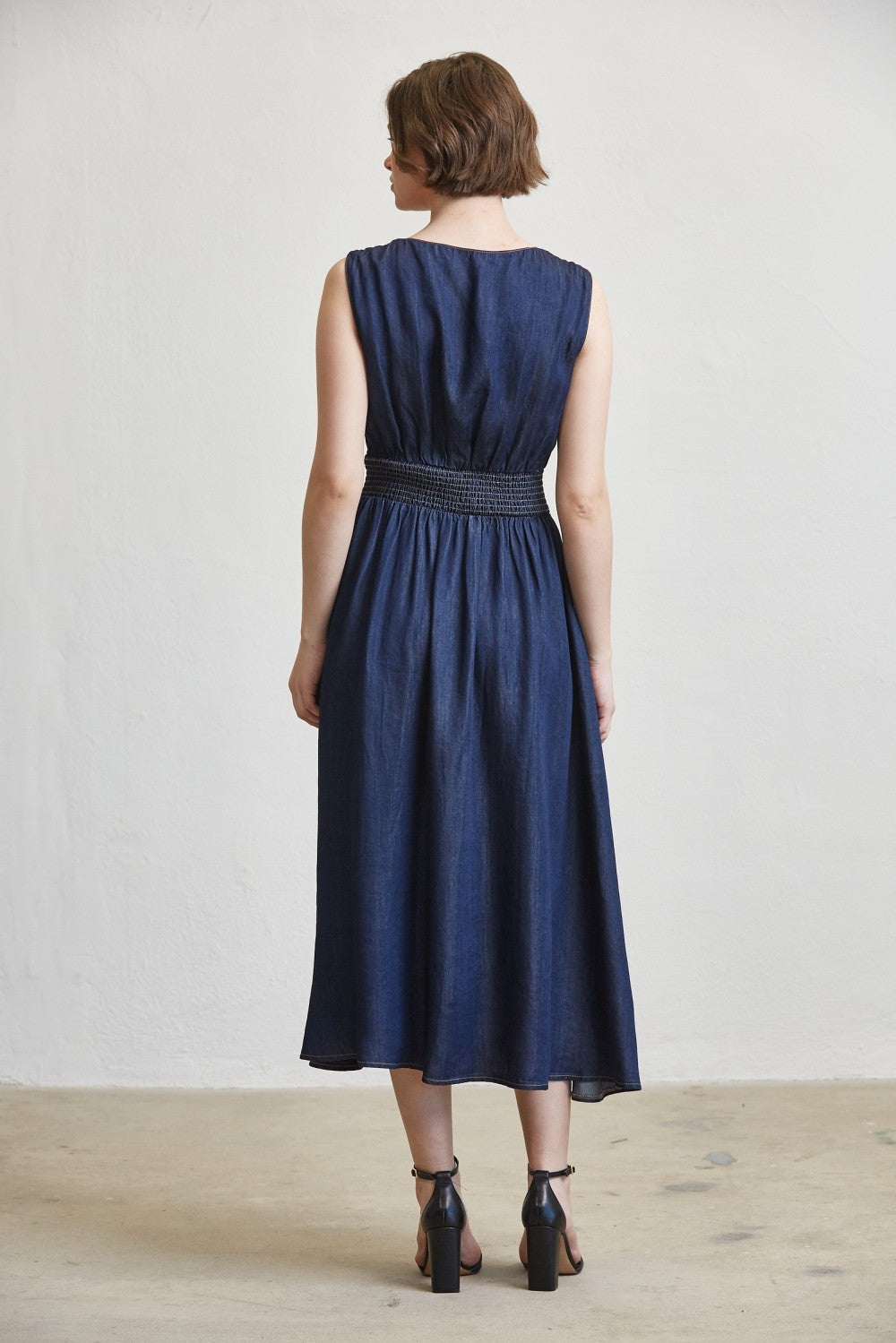 SLEEVELESS SMOCKED WAIST ZIP FRONT MIDI DRESS--DK. DENIM
