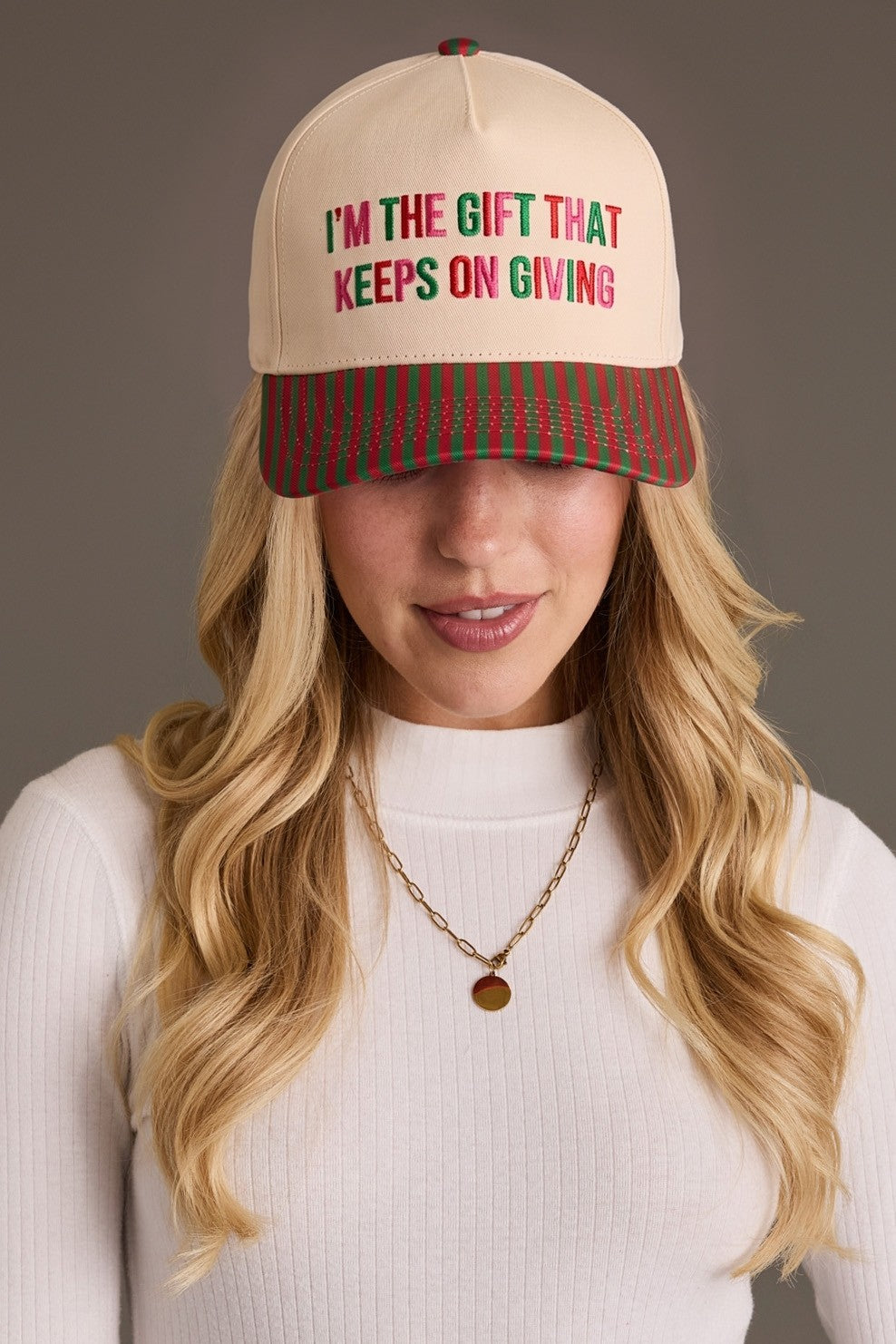 KEEPS ON GIVING STRIPED TRUCKER HAT